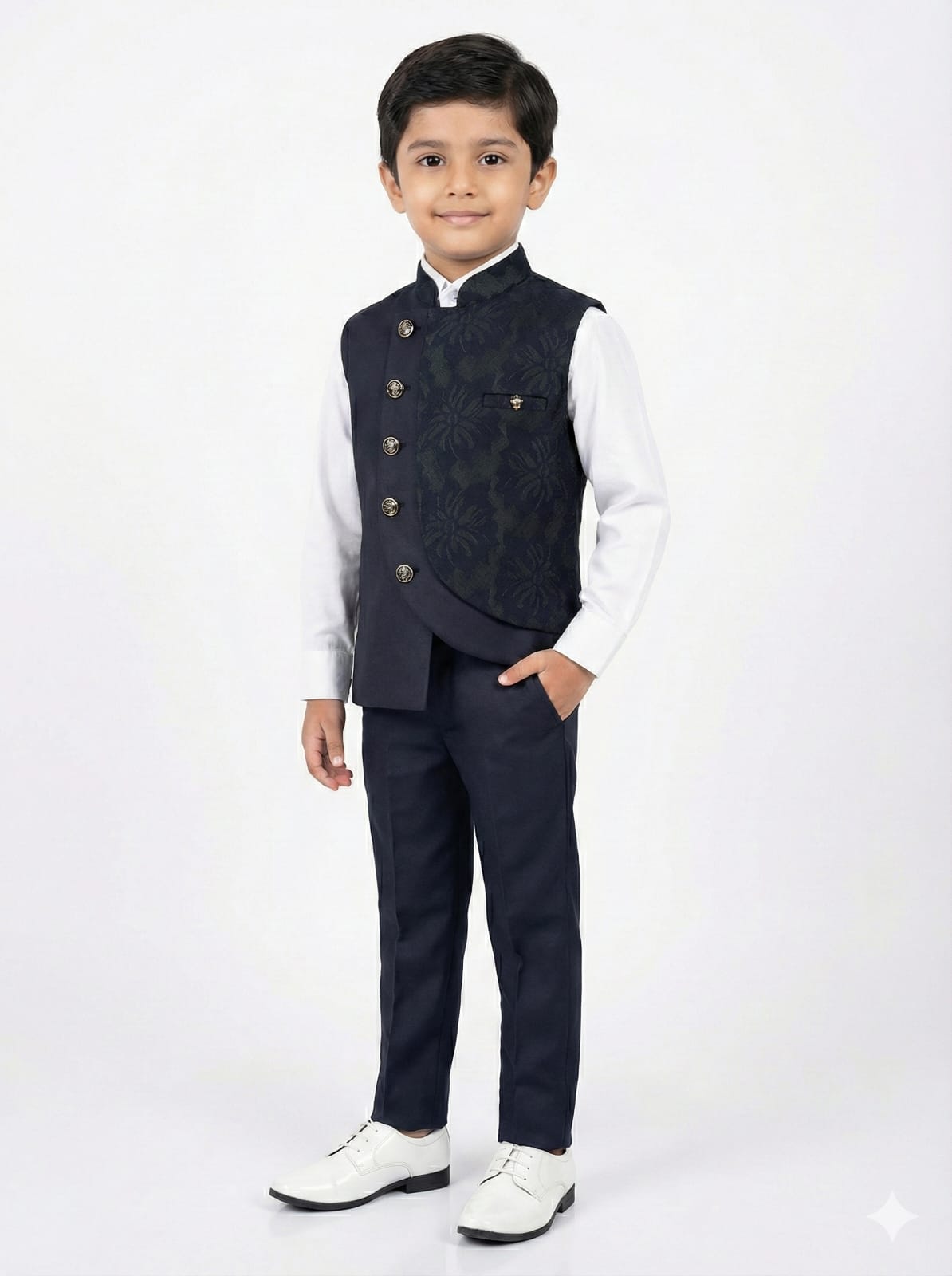 Young boy wearing a formal outfit with a vest on a white background