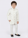 Child wearing a white traditional outfit on a light gray background