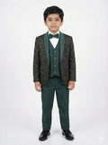 Young boy wearing a green formal suit with a white shirt and bow tie on a white background