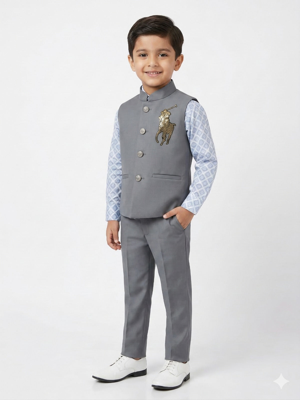 Young boy wearing a gray suit with a patterned shirt on a white background