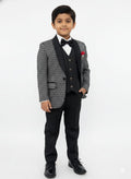 Young boy wearing a formal suit with a white shirt and bow tie on a white background