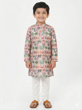 Child wearing a colorful kurta with white pants on a light gray background