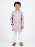 Young boy wearing a light purple kurta with white pants on a white background