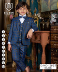 Young boy in a blue checkered suit standing in an ornate room with decorative furniture.