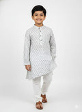 Young boy wearing a white kurta with a subtle pattern on a white background