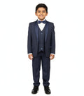 Young boy wearing a navy blue suit with a white shirt and black shoes on a white background