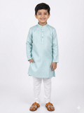 Young boy wearing a light blue kurta with white pants on a white background