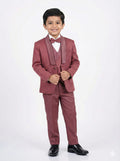 Young boy wearing a maroon suit with a white shirt and black shoes on a white background