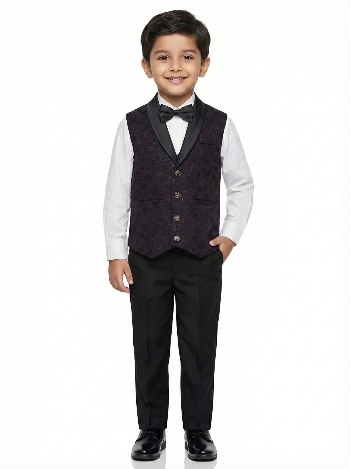 Young boy wearing a formal black vest and suit on a white background